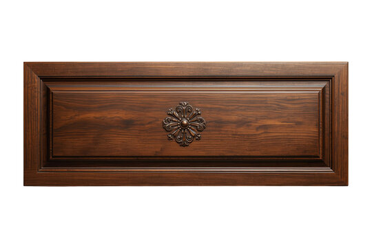 Dark wooden drawer front with ornate metal pull isolated