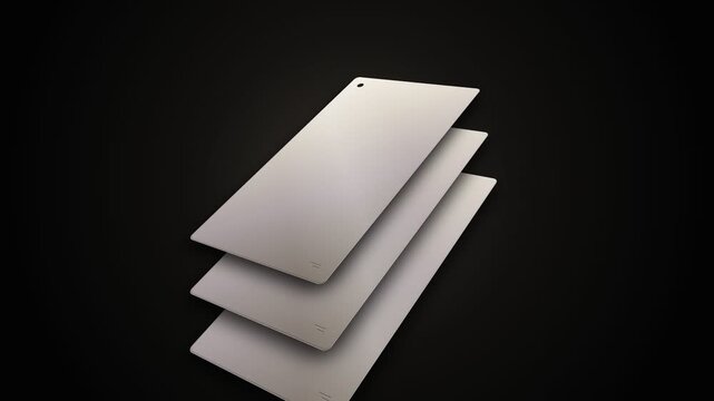 Three rectangular metal plates are arranged in a cascading stack formation to demonstrate high quality architectural construction materials for industrial design projects and interior surface