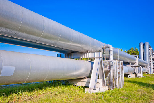 pipeline m pipeline elements close-up, blue sky in the background, green grass in the foreground