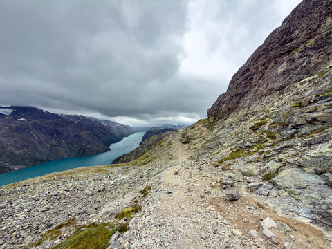 Rocky trail below a cliff face on Besseggen, Jotunheimen, Norway