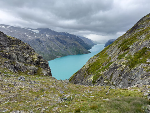 Lake Gjende framed by steep mountain flanks, Jotunheimen, Norway