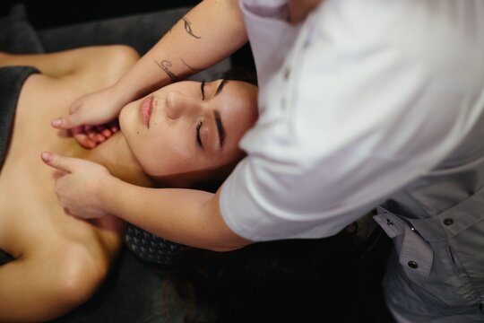 Woman receiving relaxing neck and shoulder massage