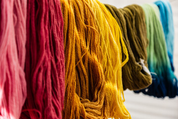 Colorful alpaca wool yarn used in traditional Andean textiles, Peru © Gino Tuesta