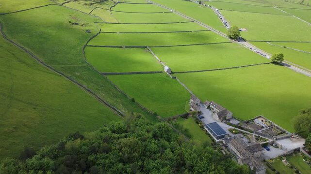 Aerial view of the dramatic Cave Dale limestone valley with a hiking path, Castleton, Peak District, England
