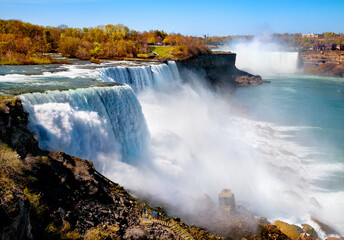 Majestic niagara falls water flowing down rocky cliff edge with waterfall landscape cascades outdoors majestic ©  SobuzForge