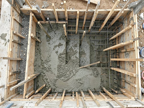 Top view of concrete foundation construction with wooden formwork