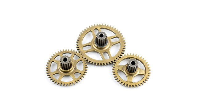 Three interlocking brass metal gears isolated on a clean white background
