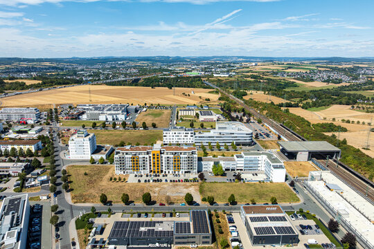 Drone aerial view of Ice Stadt Limburg an der Lahn business district, Limburg S&uuml;d station and A3 motorway, Germany