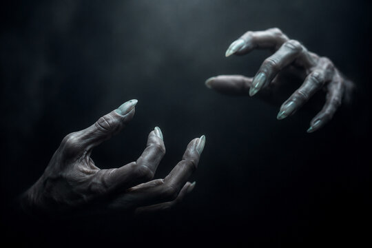 AI generated eerie gray hands reaching through darkness long pale nails dramatic shadows representing fear mystery supernatural tension horror haunting atmosphere