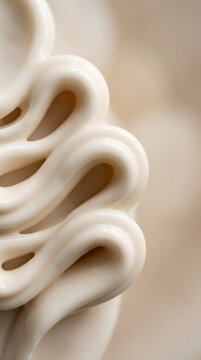 Creamy glossy swirled folds smooth texture abstract sculptural substance resembling whipped cream or lotion