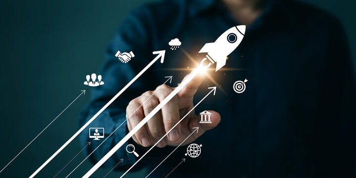 Hand touching digital rocket launch button for business startup and growth innovation with innovation business development strategy technology investment progress management corporate