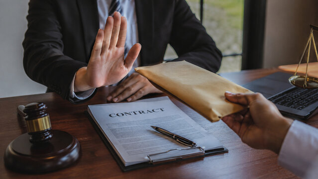 Legal professional refusing a bribe during contract review