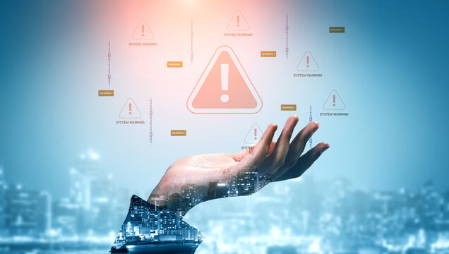Digital hand holding warning symbols over a city skyline with a futuristic theme showcasing technology and alert notifications. Glyphic.