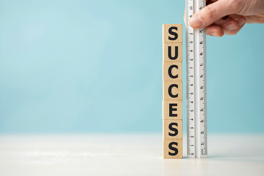 Measuring success concept with wooden letter blocks and metal ruler measurement business achievement progress strategy planning development corporate improvement performance milestone