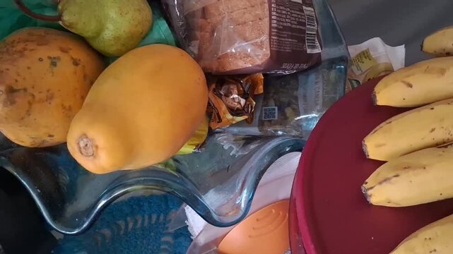 Tropical papaya and yellow bananas arranged in kitchen