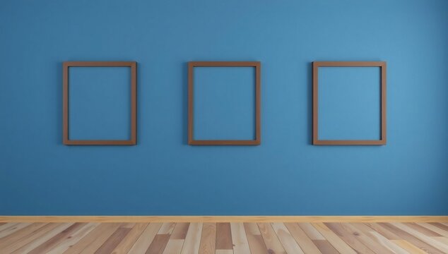 Three empty picture frames on blue wall