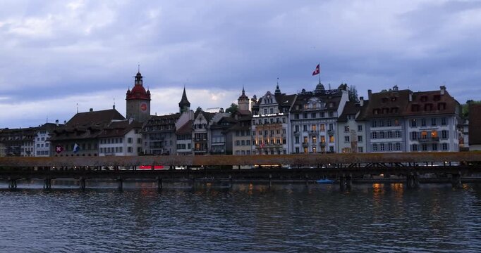 Scenic evening view of Kapellbrucke Chapel Bridge in Lucerne, Switzerland