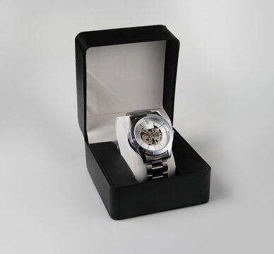 Silver Automatic Skeleton Wristwatch Displayed in Elegant Black Gift Box on White Background