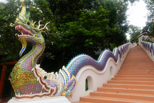 beautiful Naga staircase from a temple in the middle of a forest in Thailand