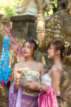 Traveler and woman tourist enjoy walking to see the historic park of Thailand exciting to explore the wonderful place of sightseeing.
