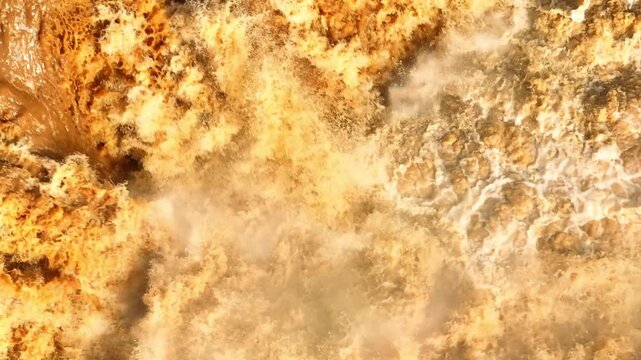High altitude view of turbulent flood currents after intense storms, highlighting climate crisis, hydrological changes, ecosystem disruption, and sustainable water resource management. Thailand. 4k.
