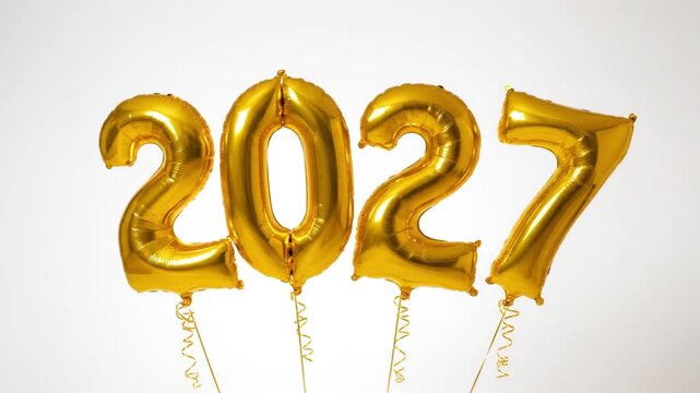 Golden foil balloons spelling 2027 new year celebration