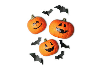Obraz premium Three pumpkins with cheerful carved faces surrounded by playful bats, PNG