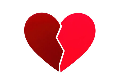 Red broken heart symbol representing relationship breakup or sadness, two halves of heart divided by crack, symbolizes heartache and separation.