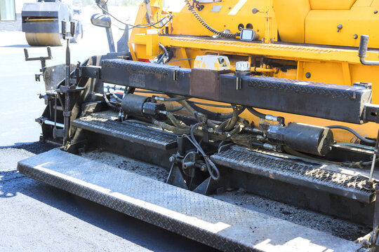 Construction equipment is used for paving roads laying asphalt at job site
