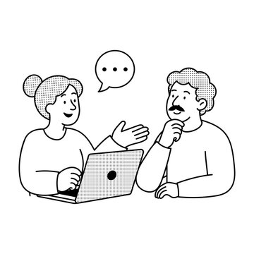 Two team members discussing notes and ideas during a collaborative review.