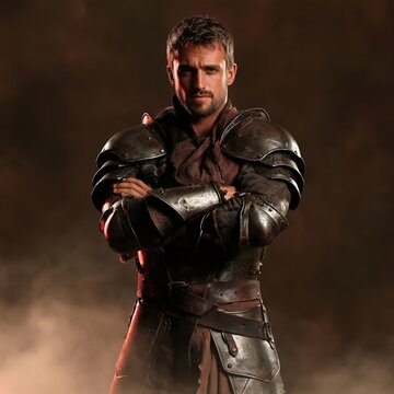 A brave medieval knight wearing detailed silver plate armor, standing with arms crossed amidst smoke and dramatic lighting.