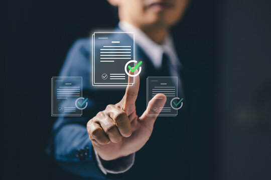 Business professional selects verified digital documents on a virtual interface, illustrating document approval, compliance, audit, validation, workflow, and secure business process.