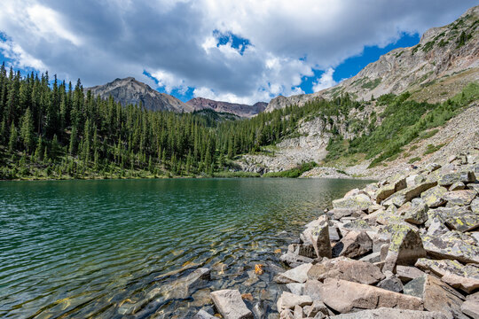 American Lake in White River National Forest and Maroon Bells-Snowmass Wilderness, Colorado under summer cloudscape.