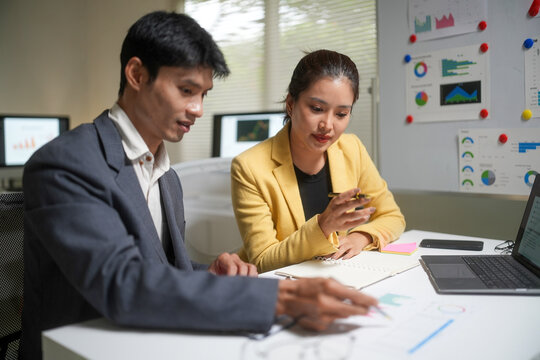 Business Team Reviewing Reports in Office Meeting