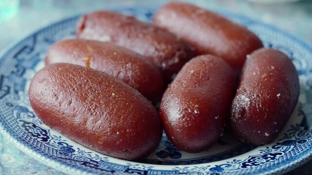 Close-up of Delicious Gulab Jamun on a Decorative Plate