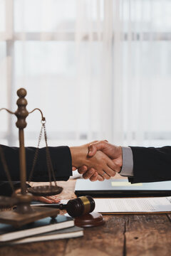 Lawyers shaking hands completing legal business deal