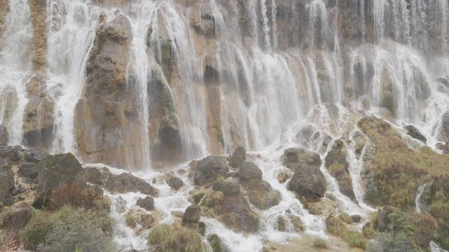 Scenery Jiuzhaigou national park in Sichuan, China. Beautiful of Nuorilang Waterfall in Autumn season. Famous Landmark and Vacation near Chengdu, China. Asia travel concept