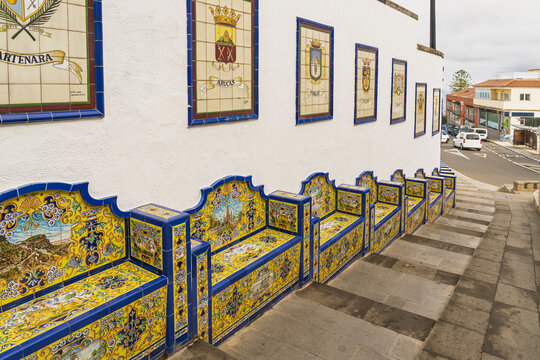 View of the colorful tiled benches and murals along the Paseo de Gran Canaria in Firgas, Canary Islands, Spain.
