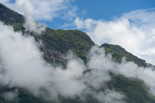 Majestic green mountains covered by flowing white clouds in Y Ty, Lao Cai province, Vietnam