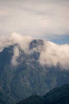 Majestic green mountains covered by flowing white clouds in Y Ty, Lao Cai province, Vietnam