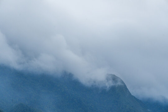 Majestic green mountains covered by flowing white clouds in Y Ty, Lao Cai province, Vietnam