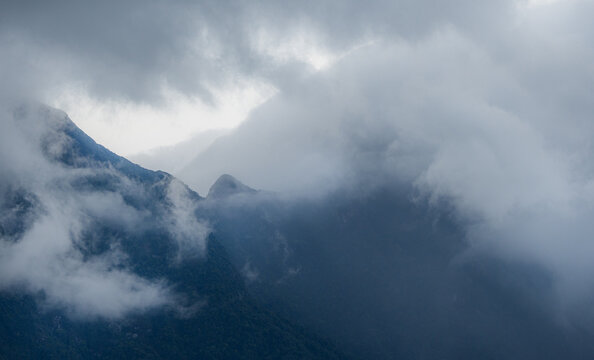 Majestic green mountains covered by flowing white clouds in Y Ty, Lao Cai province, Vietnam