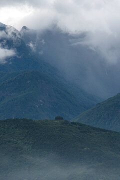 Majestic green mountains covered by flowing white clouds in Y Ty, Lao Cai province, Vietnam