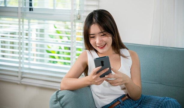 Happy beautiful woman relaxation she shopping online with smartphone