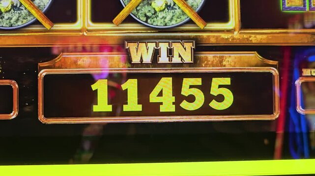 Neon casino slot machine screen showing a win total with gold coin symbols, glowing numbers, colorful reflections, and bright arcade lighting for gambling and nightlife content.