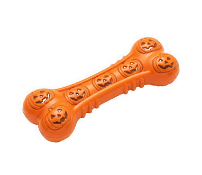 Orange rubber dog bone toy with pumpkin jackolantern faces isolated on transparent background