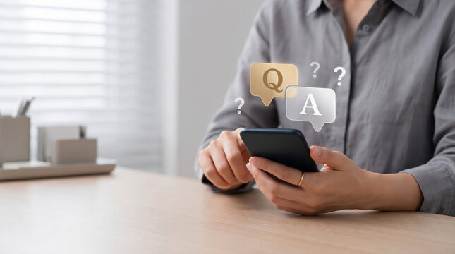 Person using a smartphone with Q and A speech bubbles. Concept of online customer support, frequently asked questions, and communication