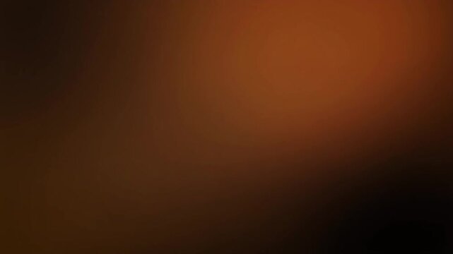 Warm honey-gold gradient light shifts and blends gradually across deep black, creating soft ambient glow, calming cinematic atmosphere, smooth color transitions, and elegant abstract motion.