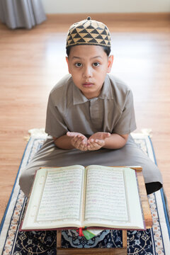 Captivating direct connection reveals a youthful believer offering profound supplication with raised hands demonstrating absolute spiritual devotion and pure religious observance
