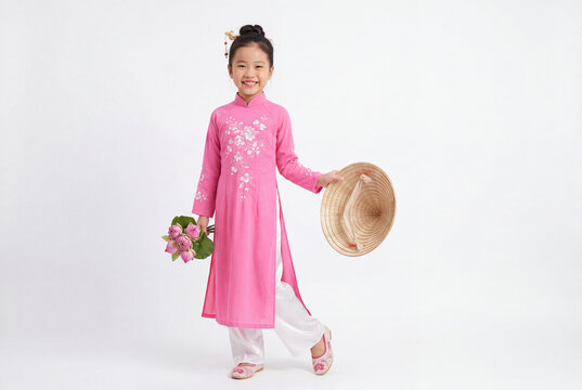 Young girl in pink ao dai holding lotus flowers and conical hat cultural heritage celebration